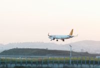 A view of an airplane soaring over the sky, representing flights from Edinburgh to Istanbul.