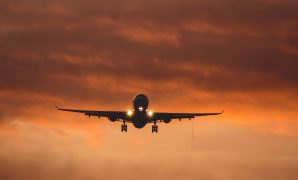 Flights from Leeds to Barcelona: a plane departing Leeds Airport toward Barcelona’s skyline.